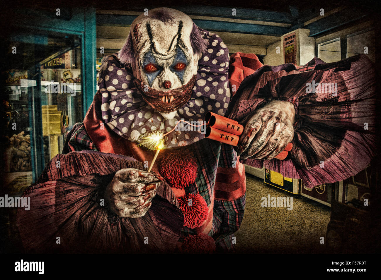Scary creepy clown with TNT/Dynamite, Stock Photo