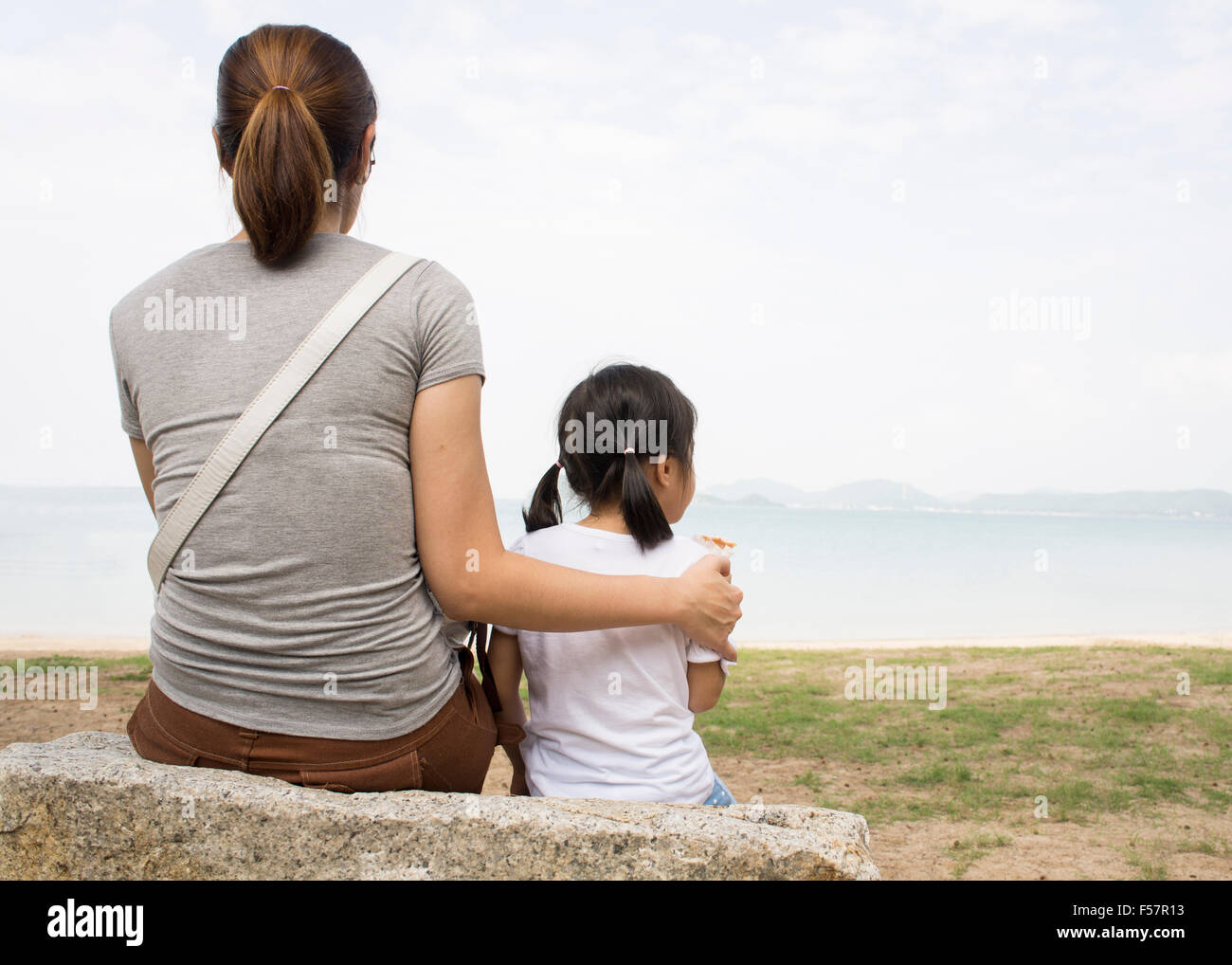 child mother mom kid son parent parenting taking care woman skin heart outdoor closeup human two motherhood safe finger Stock Photo