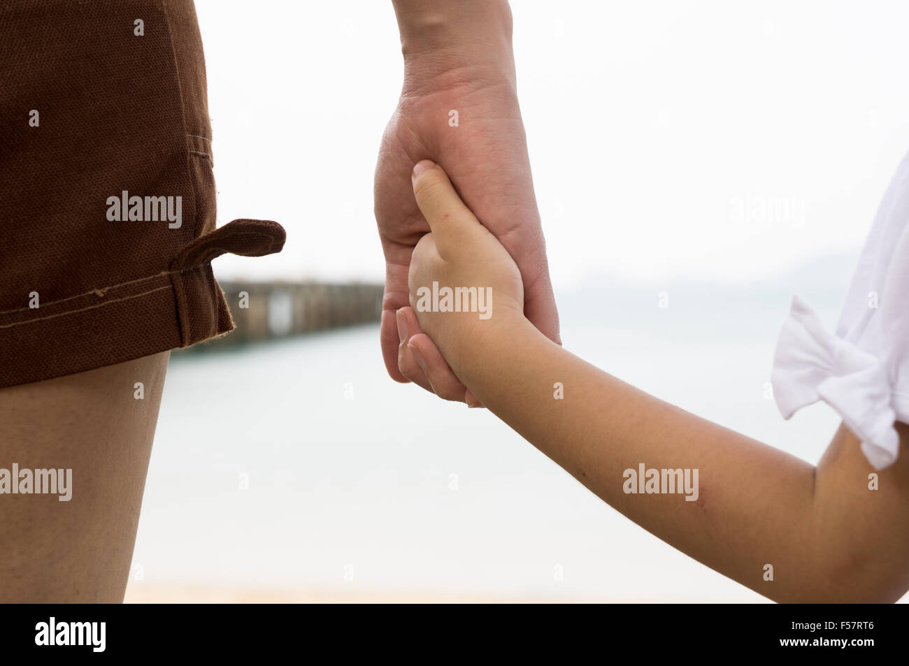 child mother mom kid son parent parenting taking care woman skin heart outdoor closeup human two motherhood safe finger Stock Photo