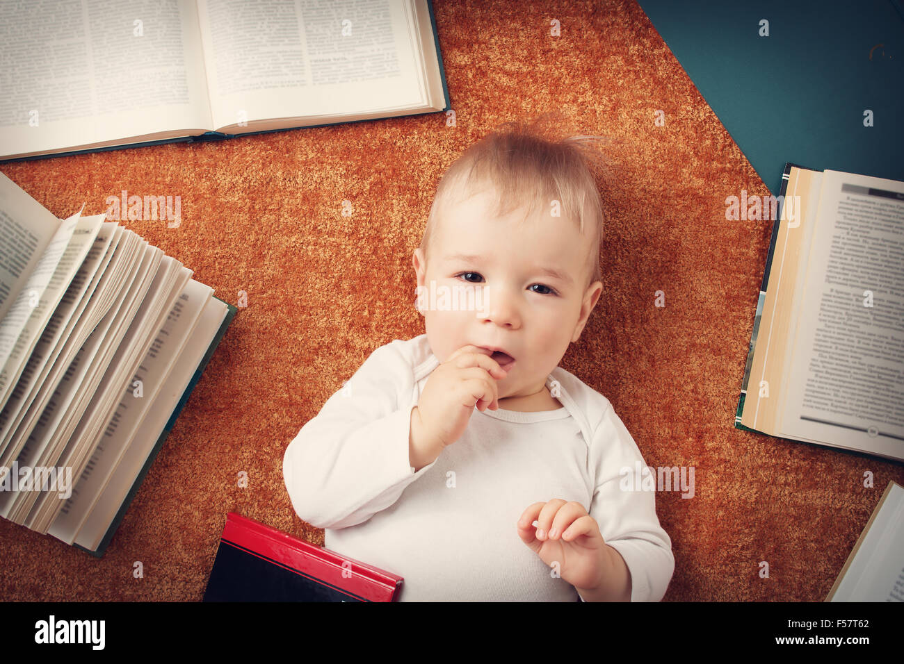 One year old baby with books Stock Photo Alamy