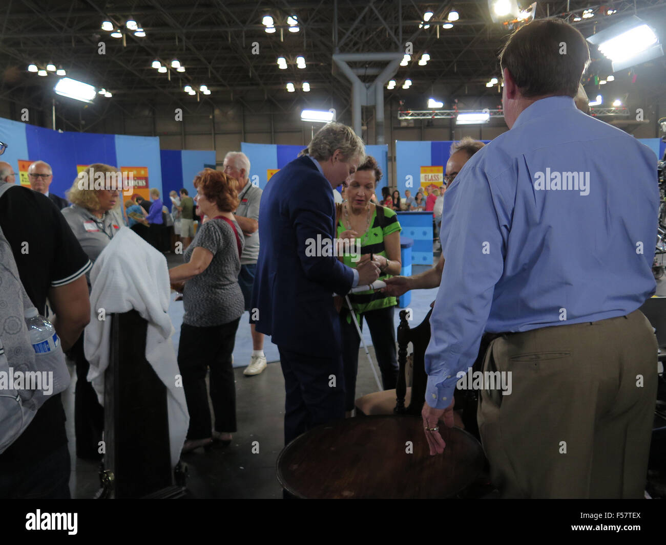 Antiques Roadshow during filming at the Javits Center in New York City, with one of Keno brothers signing autograph. Stock Photo