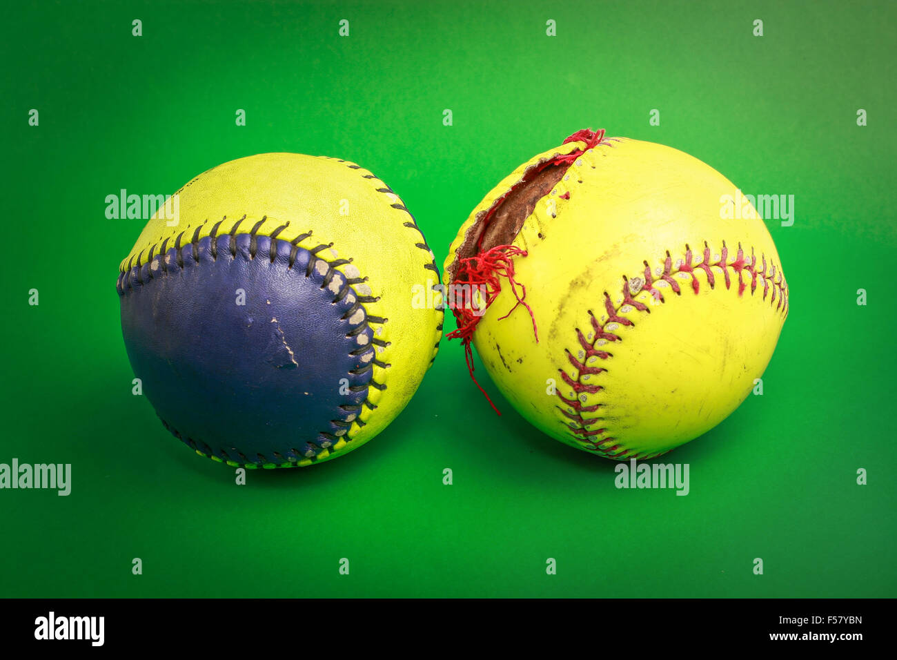 softball ball isolated on green background Stock Photo