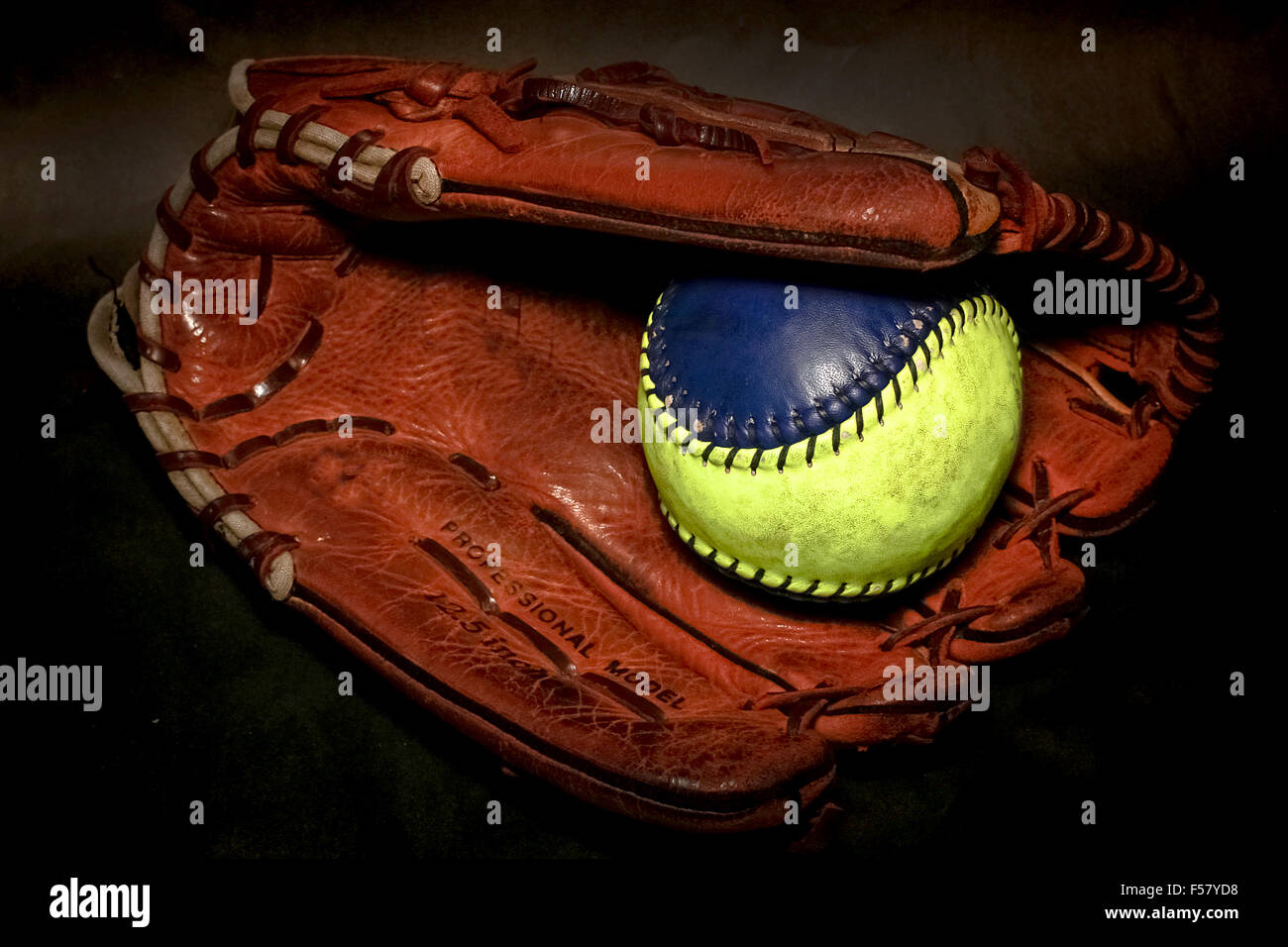Closeup of a Softball Glove and ball Stock Photo Alamy