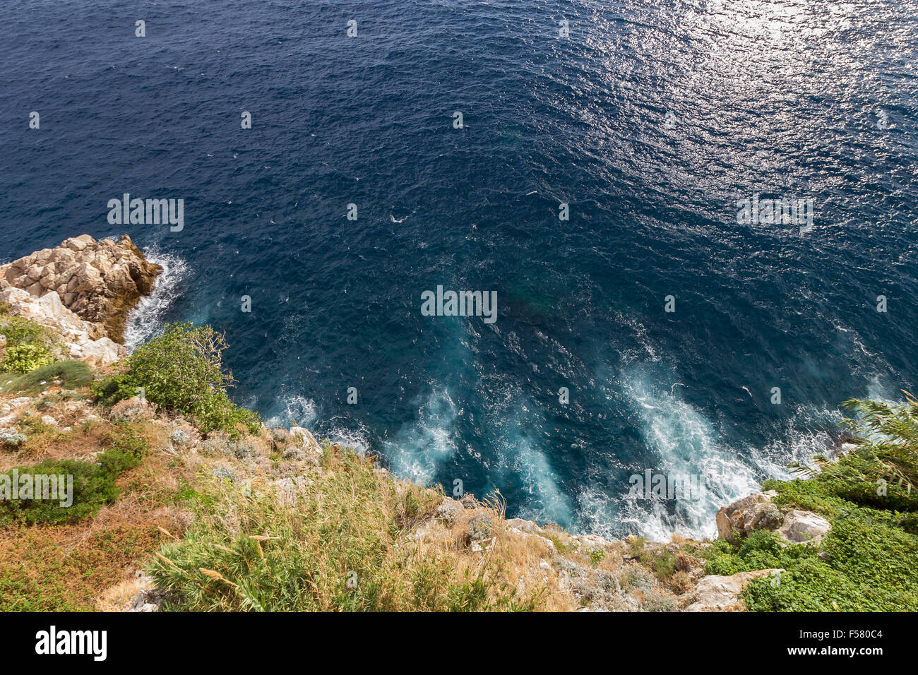 View of rocky coastline and deep blue ocean from above in Dubrovnik, Croatia. Stock Photo