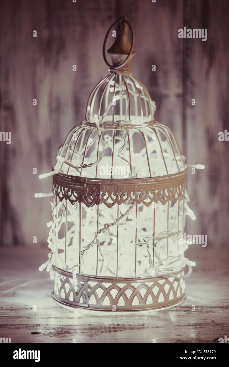 Christmas Light Decoration In A White Bird Cage Stock Photo