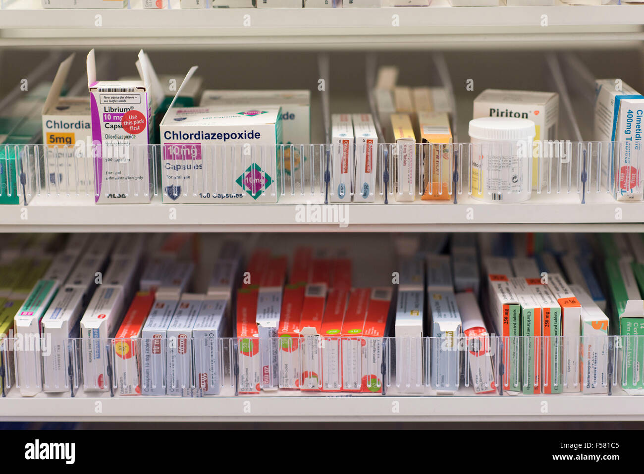 Drugs and medicines on pharmacy shelves in a chemist store. Stock Photo