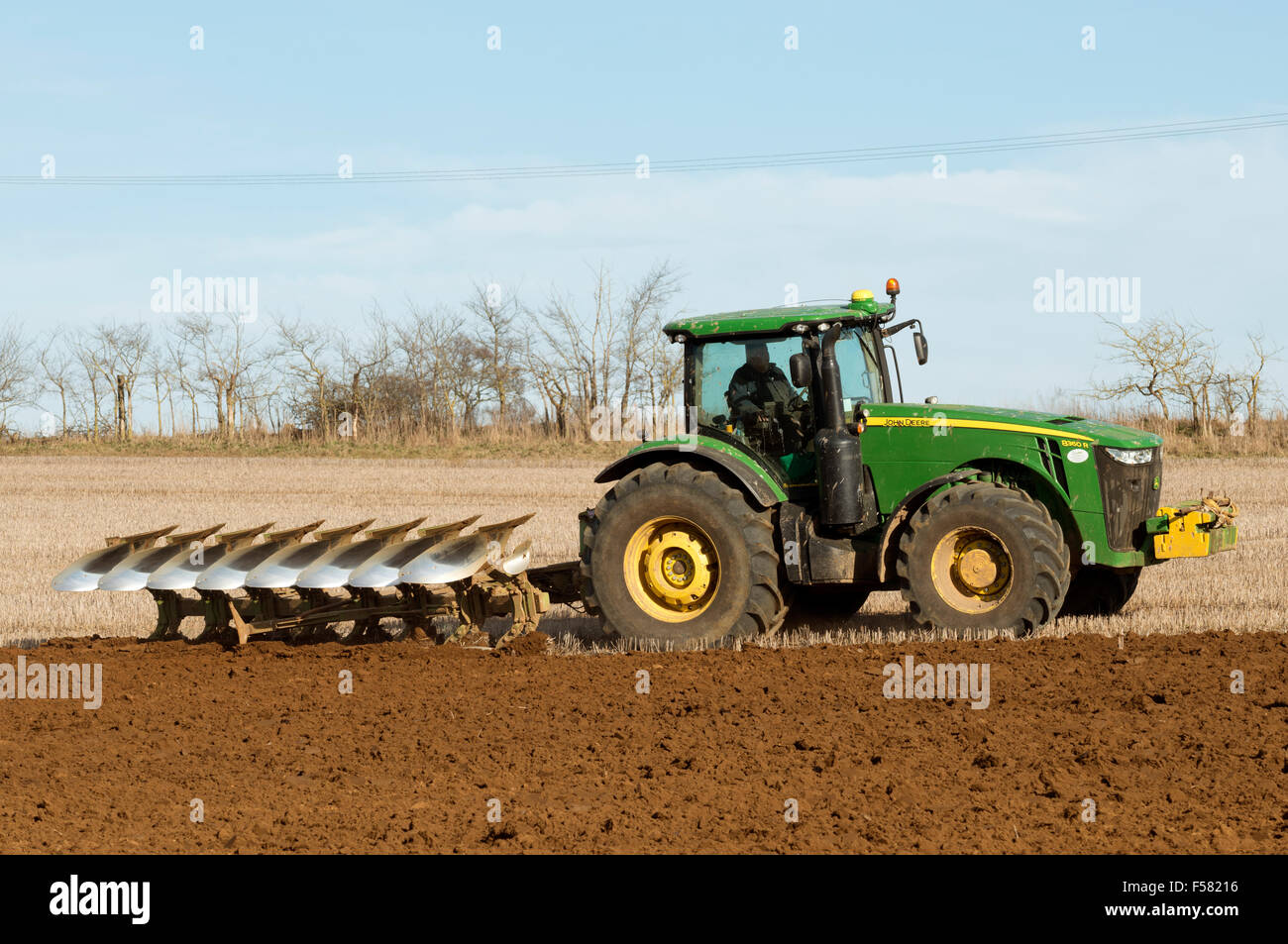 Tractor with plough Shottisham Suffolk UK Stock Photo