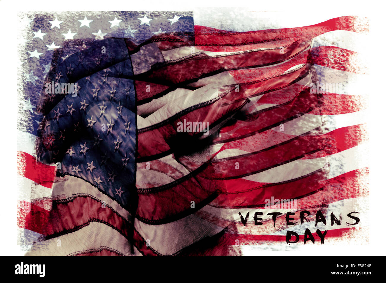 the text veterans day written in a double exposure of a flag of the United States and a closeup of the clasped hands of a man pr Stock Photo