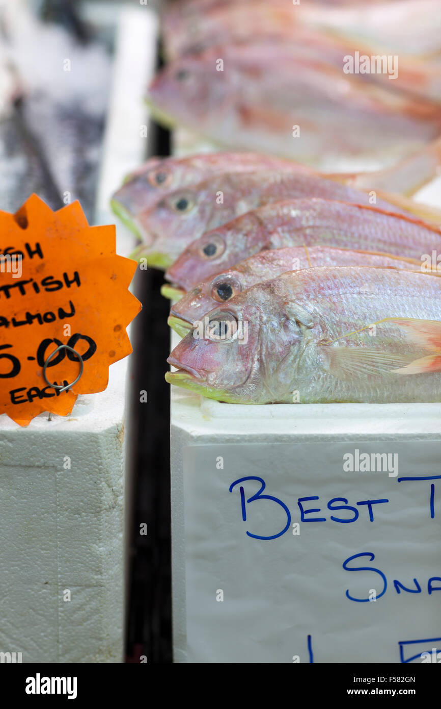 UK, Leeds, fish stall selling Japanese Threadfin Bream in Leeds market. Stock Photo