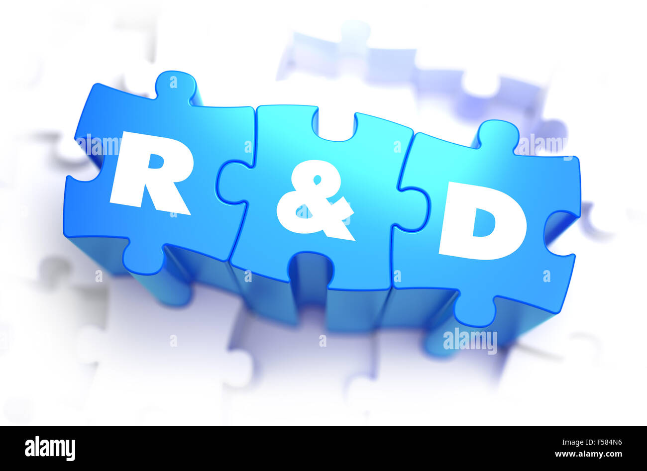 Research and Development  - Text on Blue Puzzles on White Background. 3D Render. Stock Photo