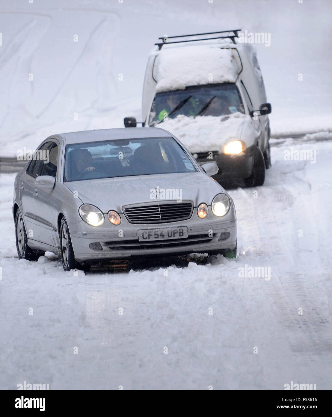 Cars struggle on roads covered in black ice and snow during heavy snowfall in Pontypridd, South Wales. Stock Photo