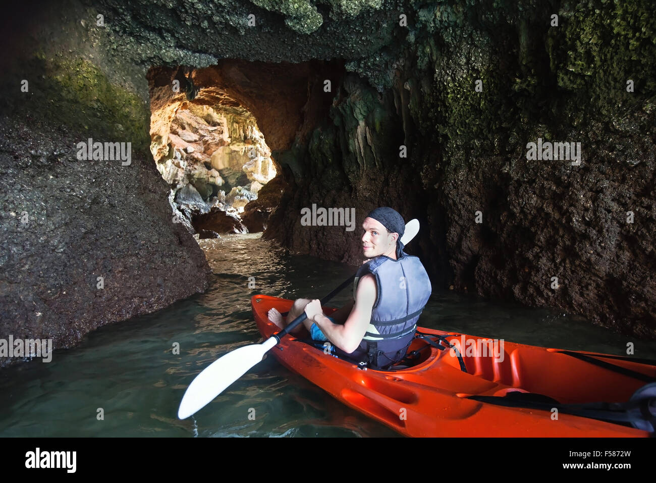 kayaking in the cave, outdoor extreme adventure Stock Photo