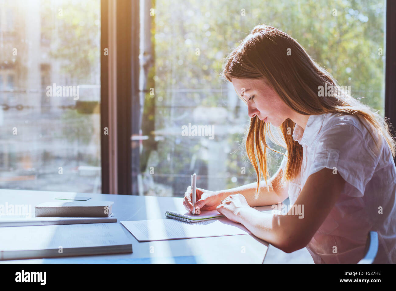 student in classroom during exam Stock Photo