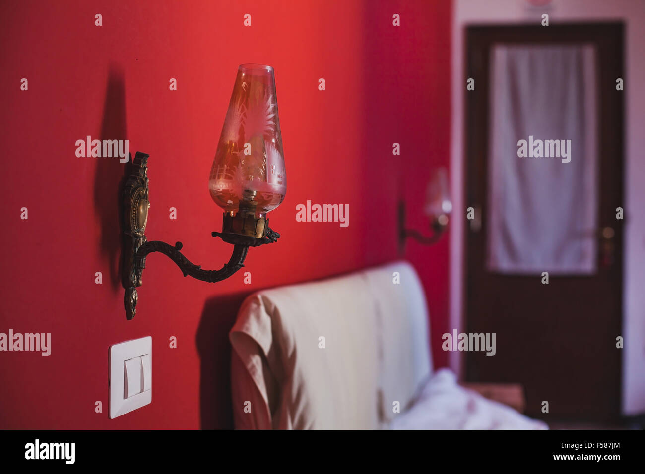 interior of abstract bedroom with red wall Stock Photo