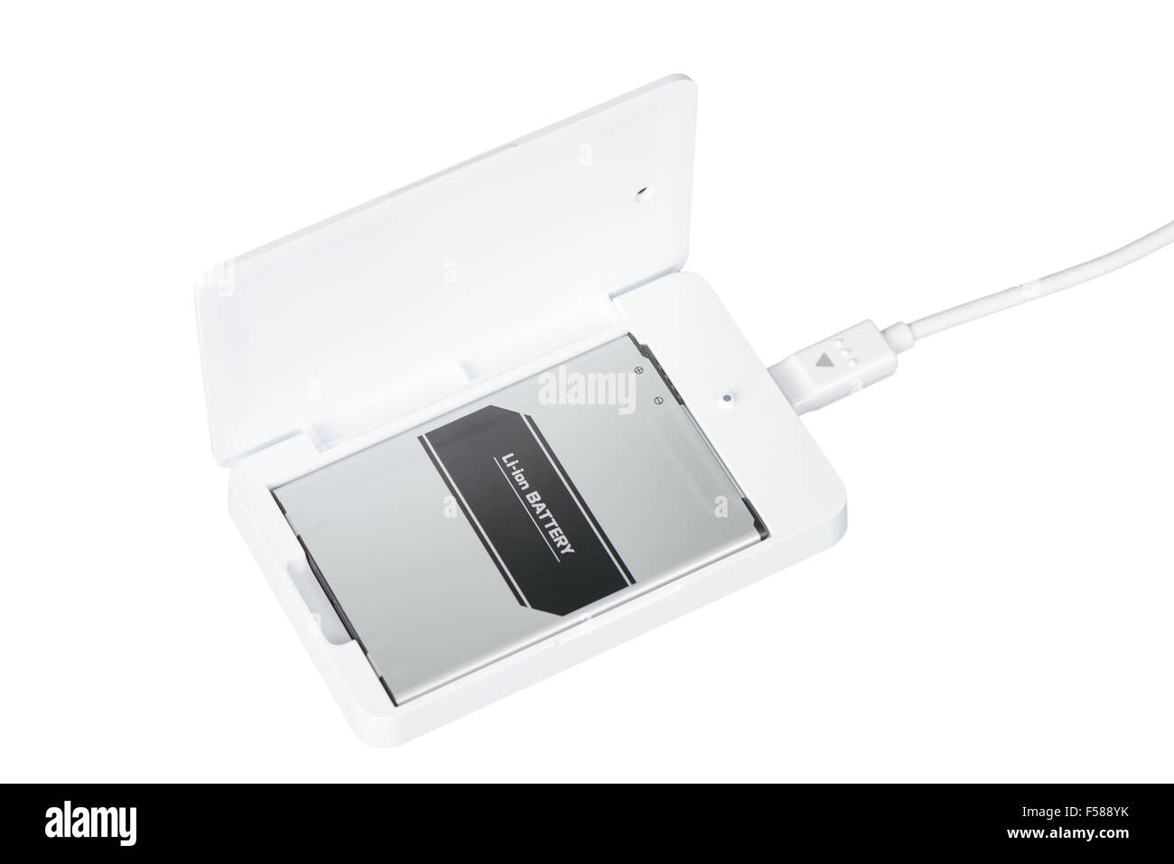 opened white smartphone battery charger with usb cable Stock Photo