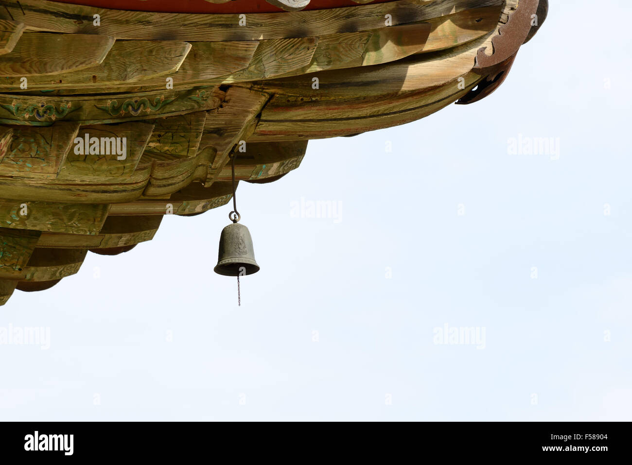 wind chime (called Punggyeong in Korean) under the eaves in a buddhist temple in Korea. Stock Photo