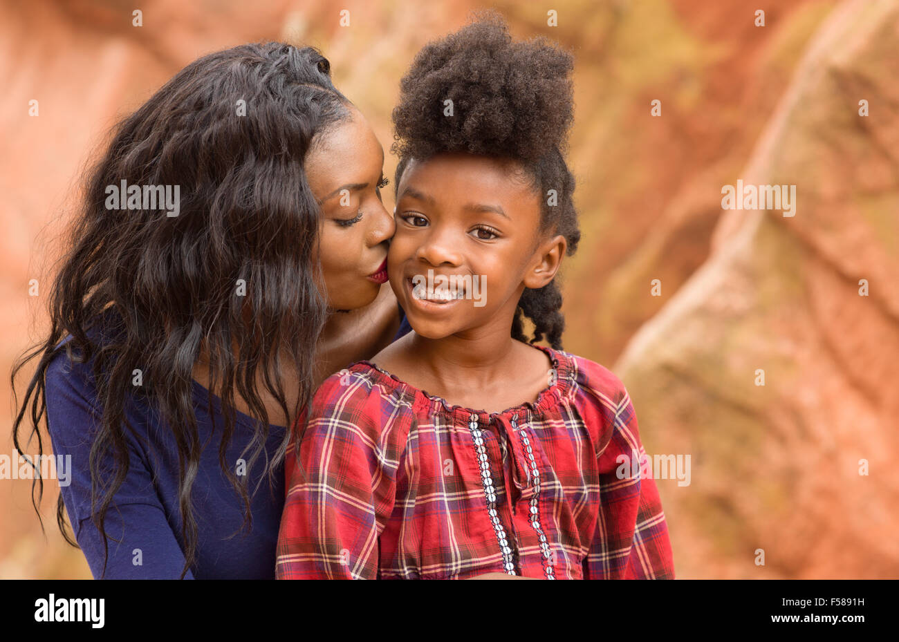 Loving mother comforting her little daughter Stock Photo