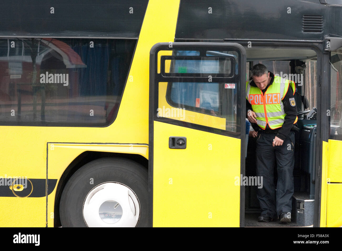 Police captain Marcel Fischer exits a bus in a parking lot by the A12  motorway near the German-Polish border near Frankfurt (Oder), Germany, 21  October 2015. Police arrested a man on the