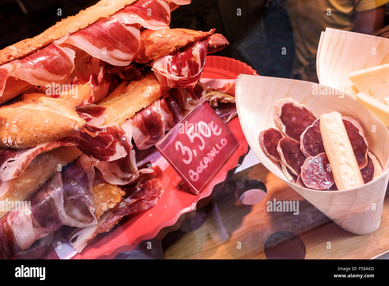 Toledo Spain,Europe,Spanish,Hispanic restaurant restaurants food dining cafe cafes,display sale tapas,Iberian ham,Iberico,cured ham,sausage,cones,sand Stock Photo