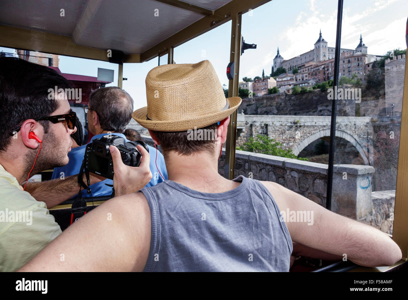 Toledo Spain,Europe,Spanish,Hispanic World Heritage Site,Zocotren,sightseeing tram train,passenger passengers rider riders,skyline,Alcazar,panoramic v Stock Photo