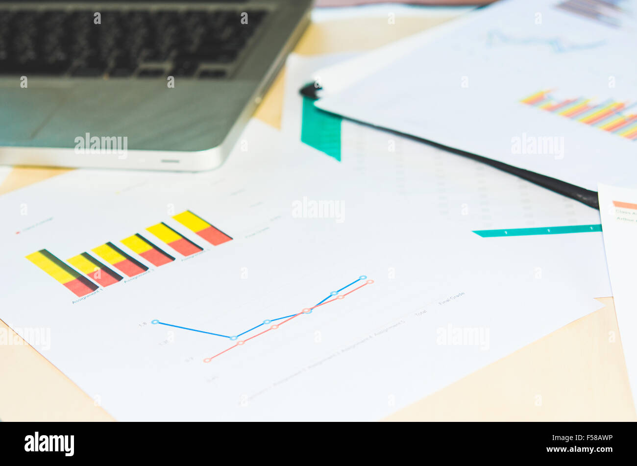 Documents, graphs on a desk Stock Photo - Alamy
