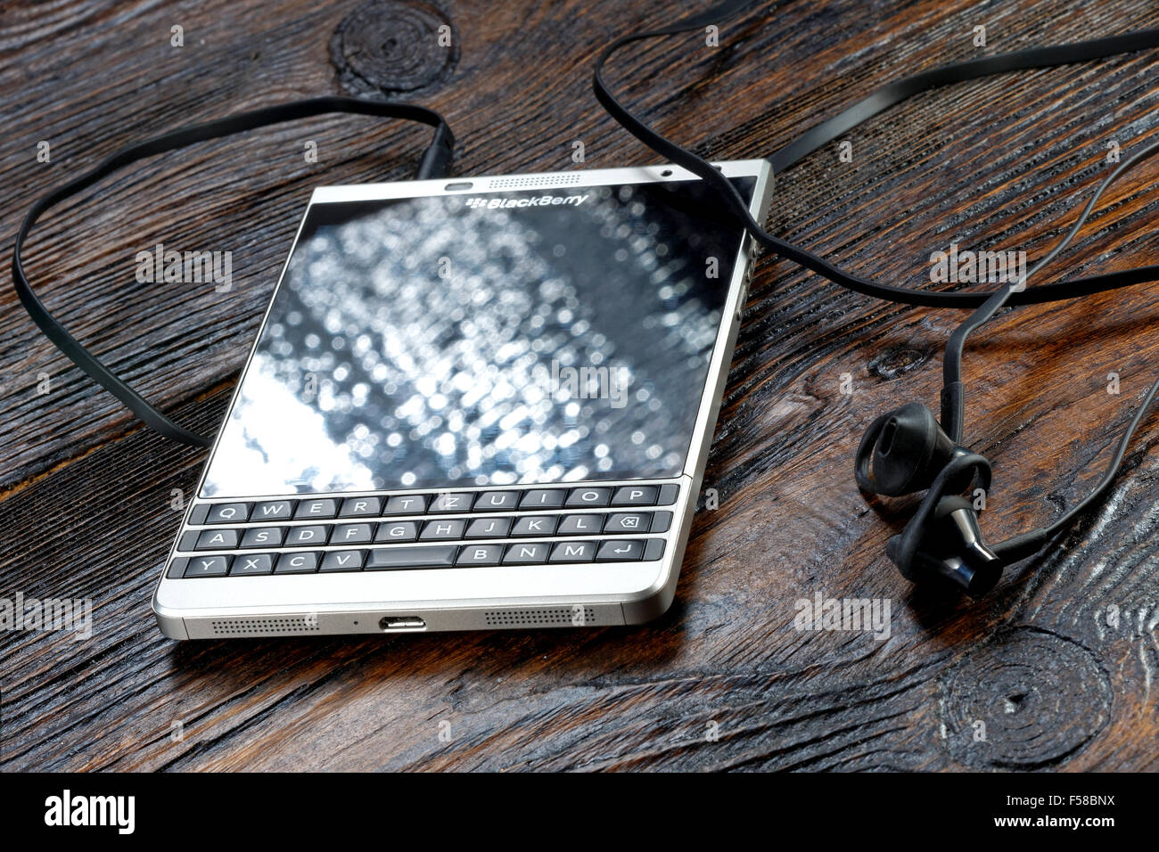 Blackberry Passport Silver Edition on wooden table Stock Photo