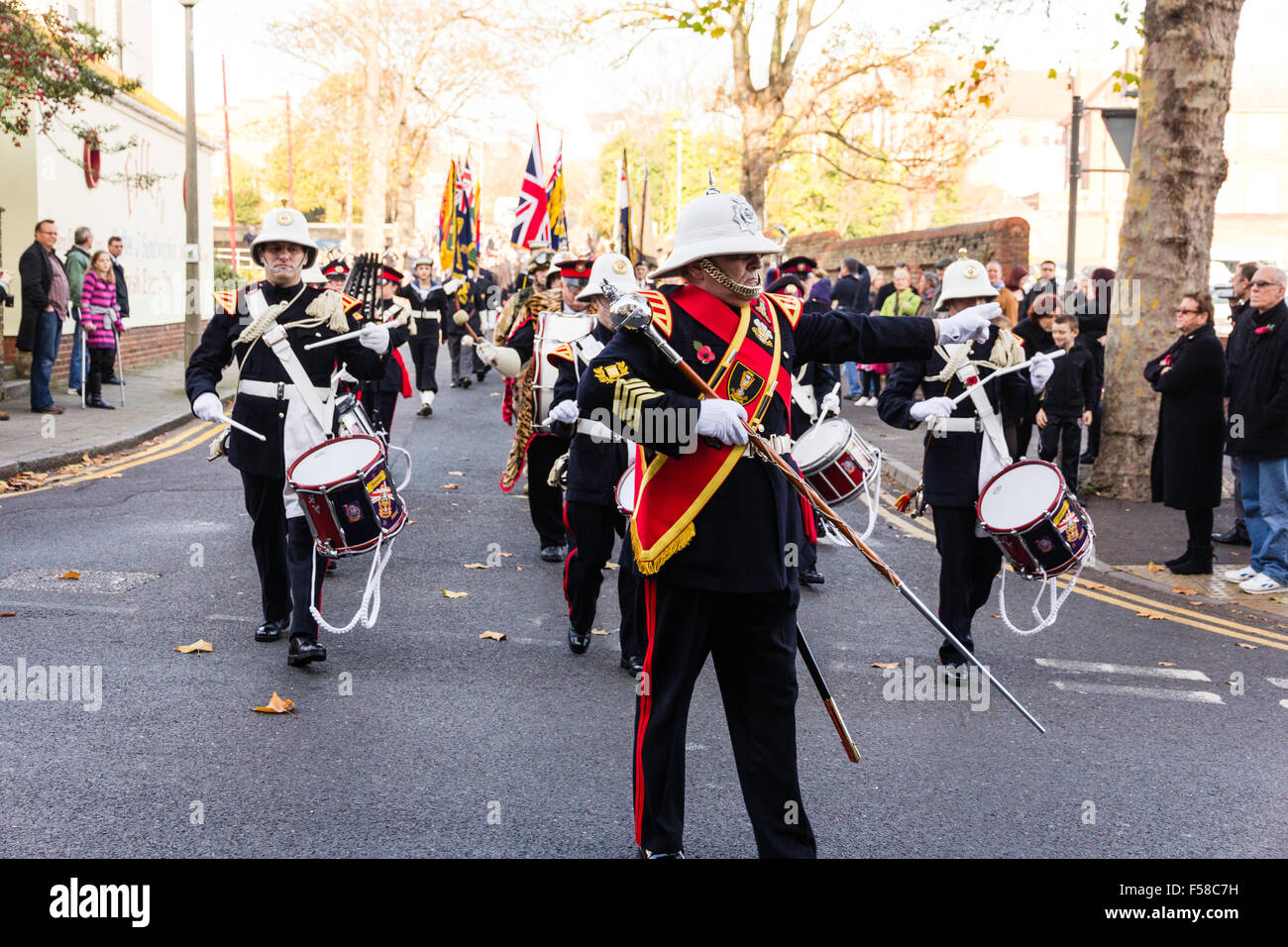 England, Ramsgate. November Remembrance Sunday Ceremony. Air-force youth band marching in parade in street towards viewer with Drum majort leading. Stock Photo