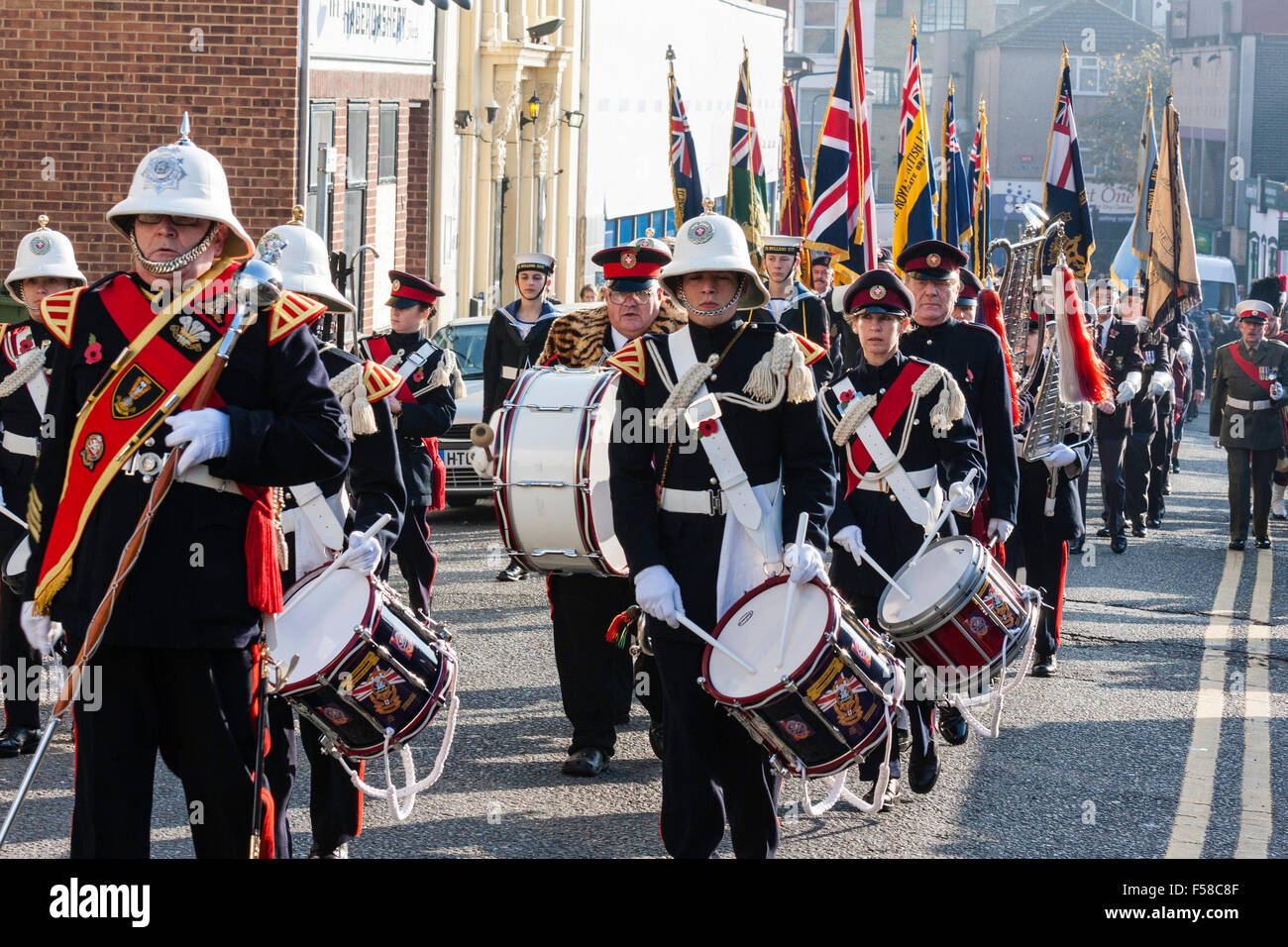 England, Ramsgate. November Remembrance Sunday Ceremony. Air-force youth band marching in parade in street towards viewer with Drum majort leading. Stock Photo