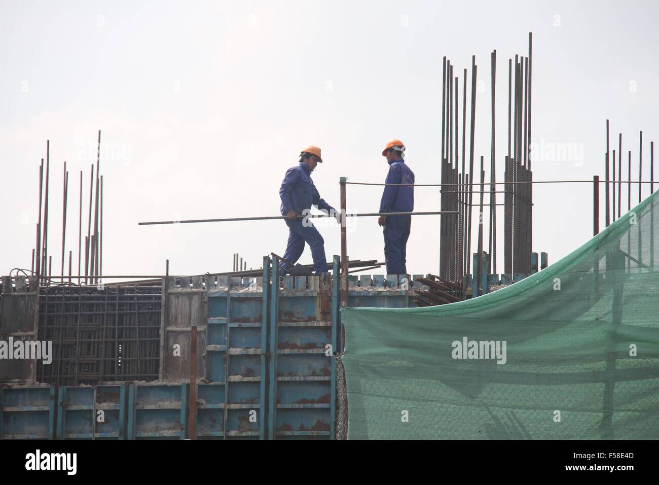 Hanoi. 30th Oct, 2015. Workers carry out construction at the Cat Linh-Ha Dong urban railway project in Vietnam's capital Hanoi, Oct. 30, 2015. The Cat Linh-Ha Dong urban railway project, totaling 13.5 km and allowing a maximum speed of 80km per hour, is constructed by the 6th bureau of China Railway Engineering Corporation. Credit:  Le Yanna/Xinhua/Alamy Live News Stock Photo