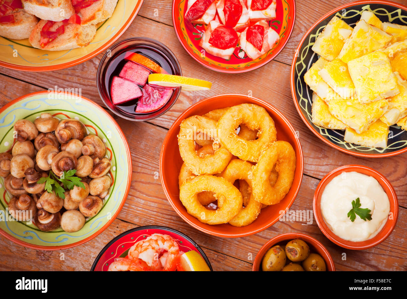 A table filled with all sorts of Spanish tapas and sangria. Stock Photo