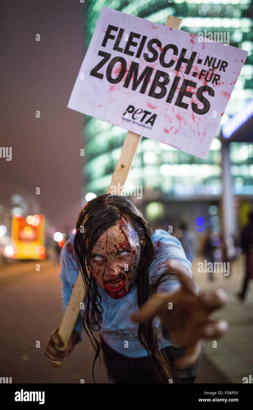 Berlin, Germany. 29th Oct, 2015. Activists of the organization Peta (People for the Ethical Treatment of Animals) are dressed up as zombies as they protest the meat industry on Potsdamer Platz square in Berlin, Germany, 29 October 2015. Photo: Sophia Kembowski/dpa/Alamy Live News Stock Photo