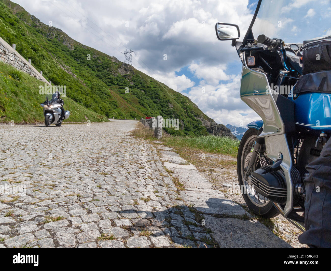Motorbikes on the historic cobble stone paved Gotthard pass road (Tremola) that connects the Swiss cantons of Uri and Ticino. Stock Photo