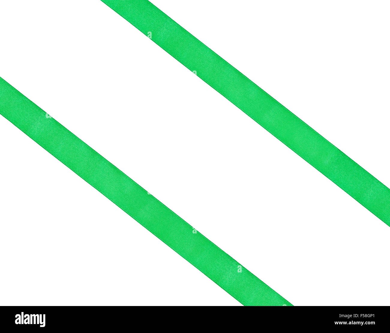 two diagonal parallel green silk ribbons isolated on white background ...