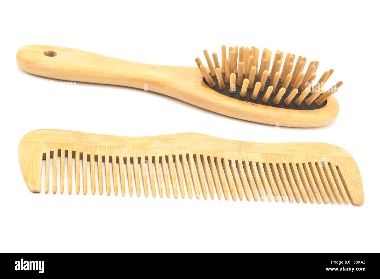 Wooden comb and brush isolated on white Stock Photo