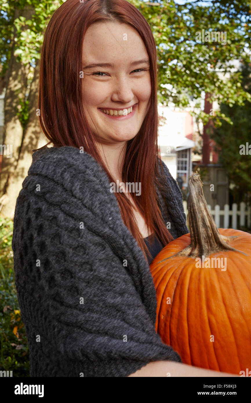 Young Woman With Pumpkin Stock Photo