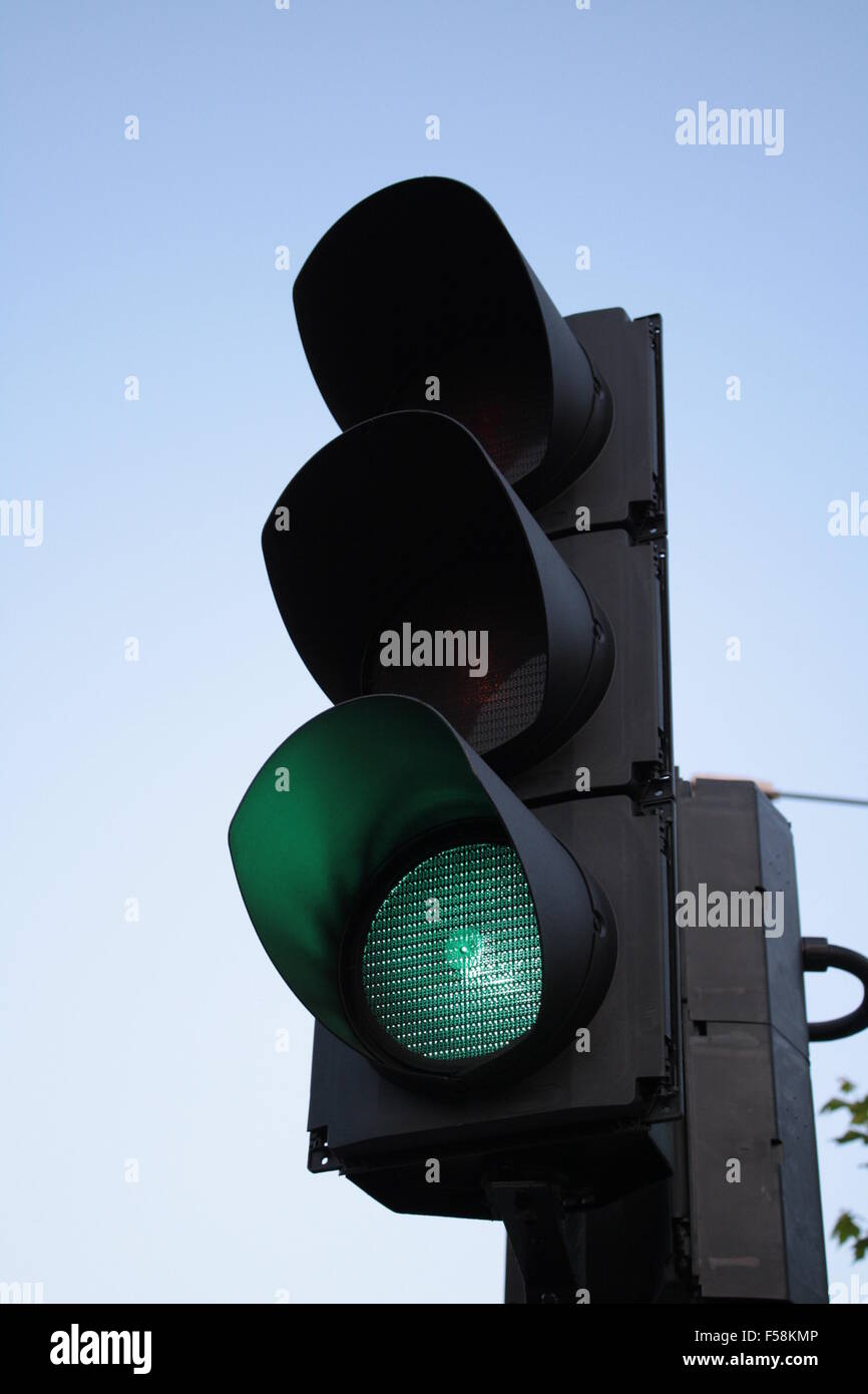 Close up of a traffic light on green Stock Photo - Alamy