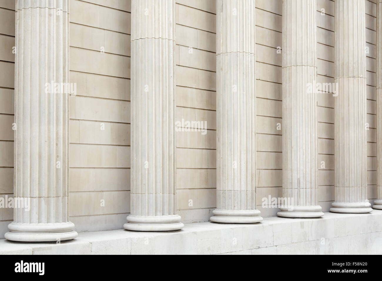 White classical columns and wall background, perspective view Stock Photo