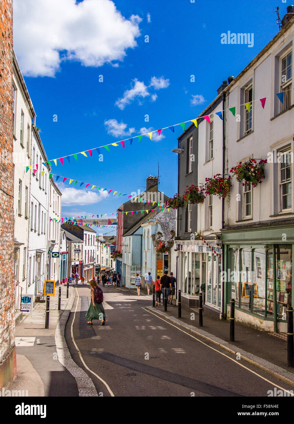 The High Street in Falmouth during the summer decorated with colourful bunting and flower baskets, Cornwall, UK. Stock Photo