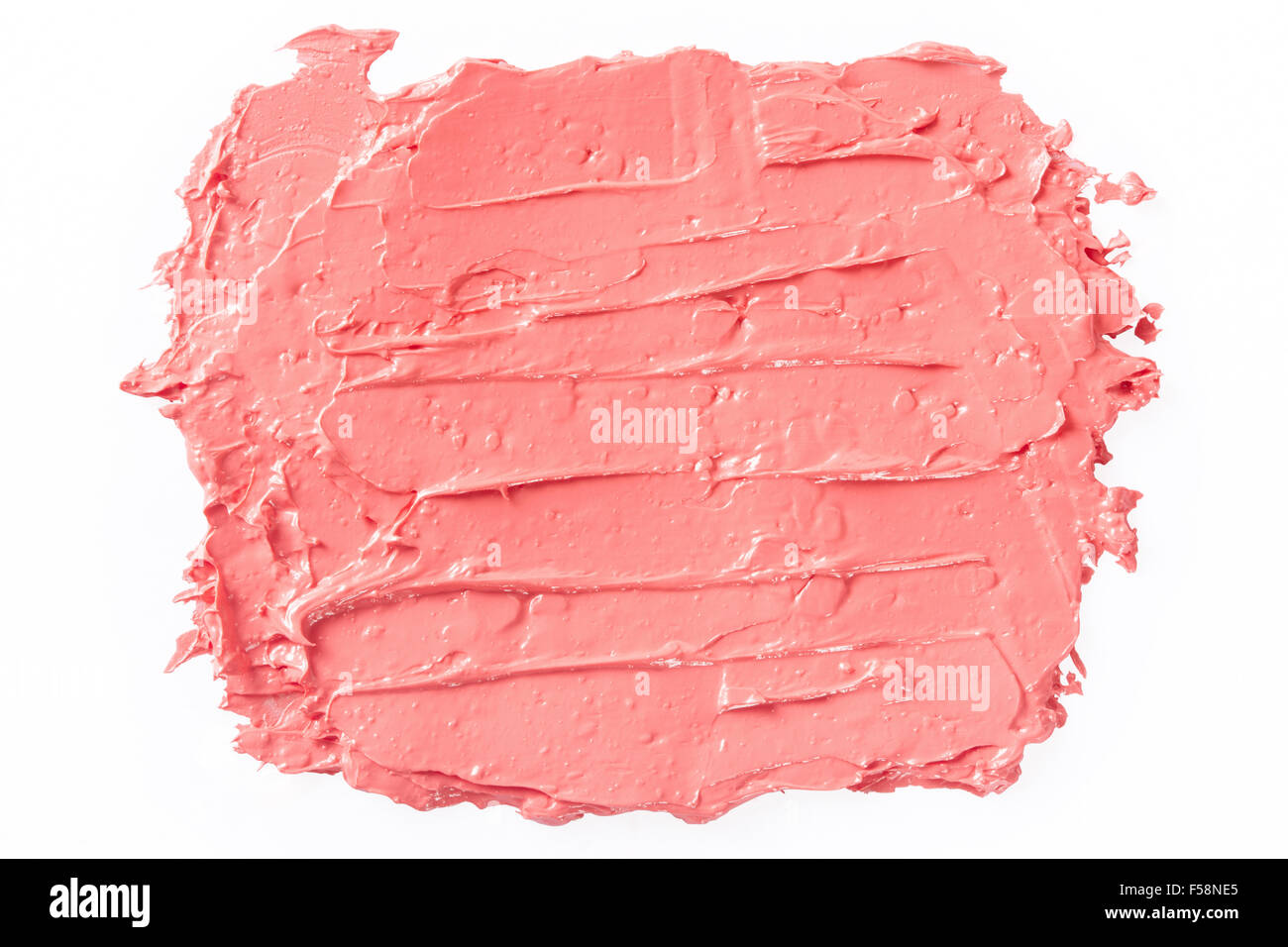 Smudged lipstick, coral red stroke on white Stock Photo