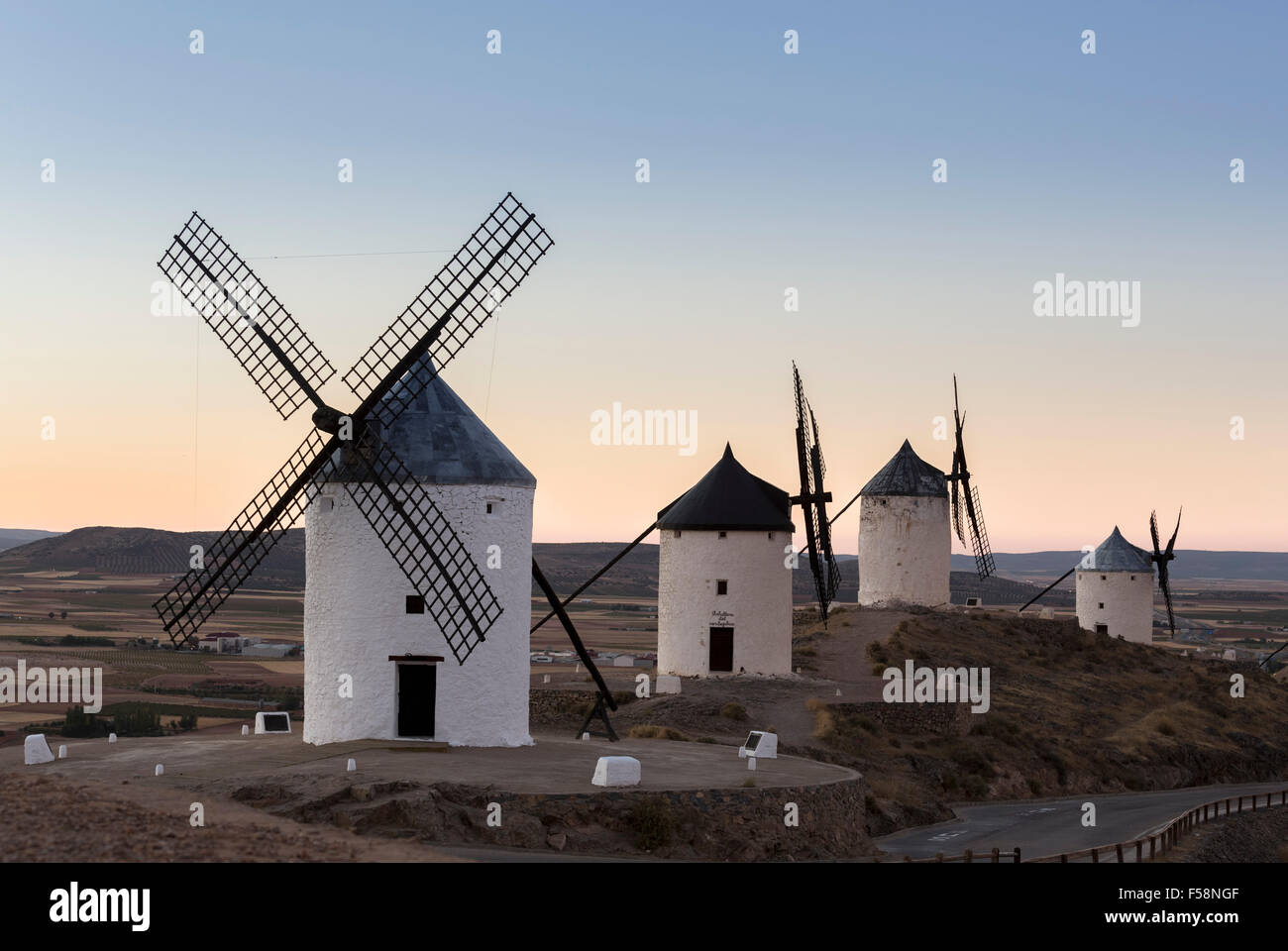 Preserved historic La Mancha windmills on hilltop above Consuegra in Castilla-La Mancha, Spain Stock Photo
