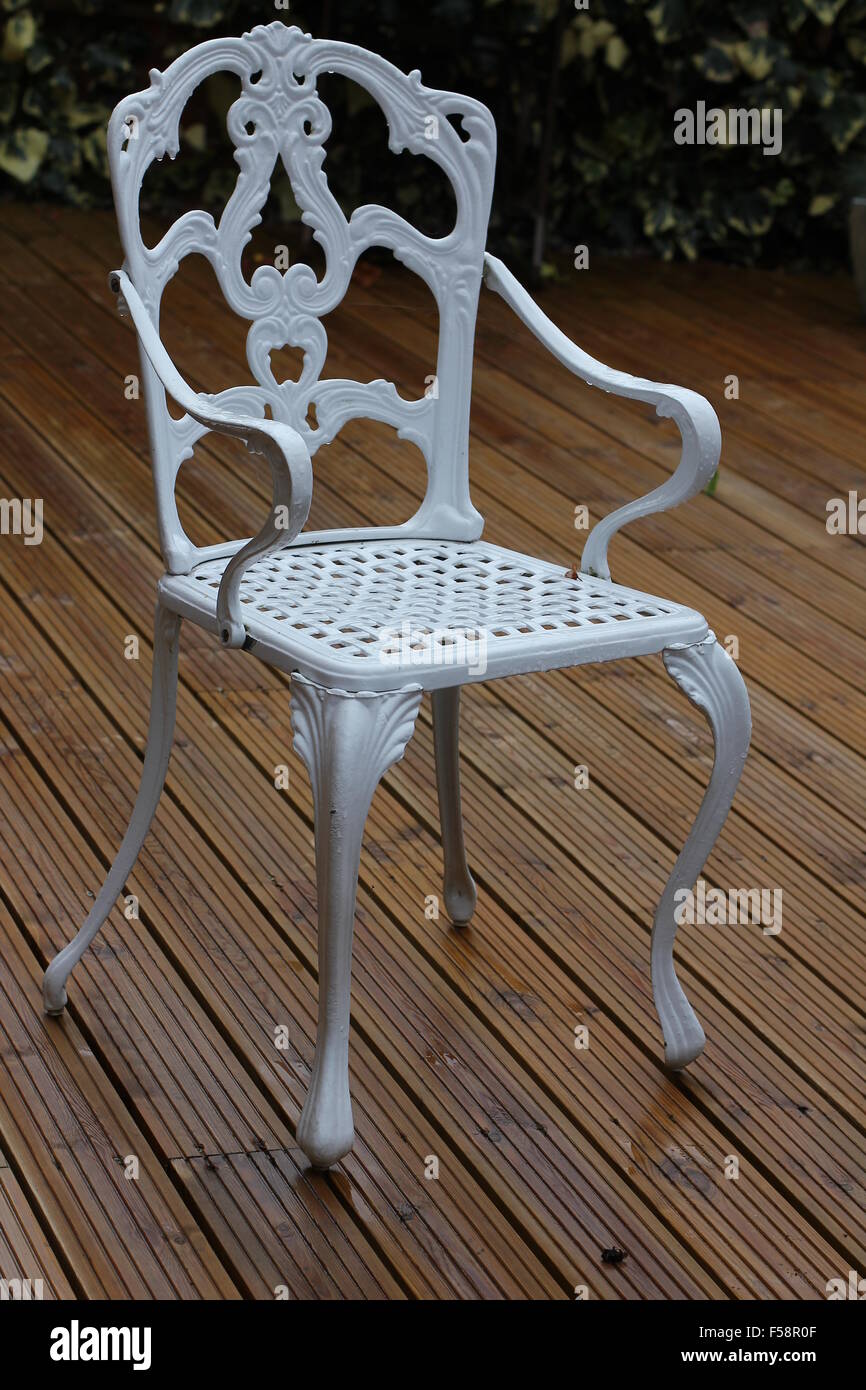 White wrought iron outdoor chair Stock Photo - Alamy