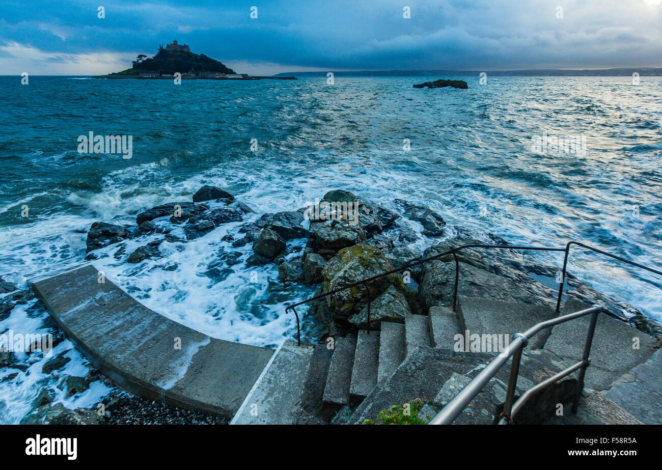 St Michael's Mount as seen from Marazion in Cornwall on a high tide in the early evening. Stock Photo