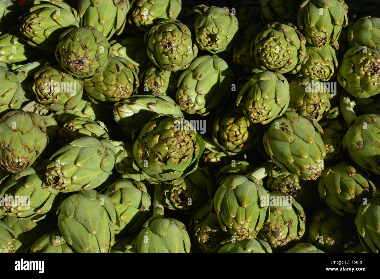 Globe Artichokes for sale on a market stall in Spain Stock Photo Alamy