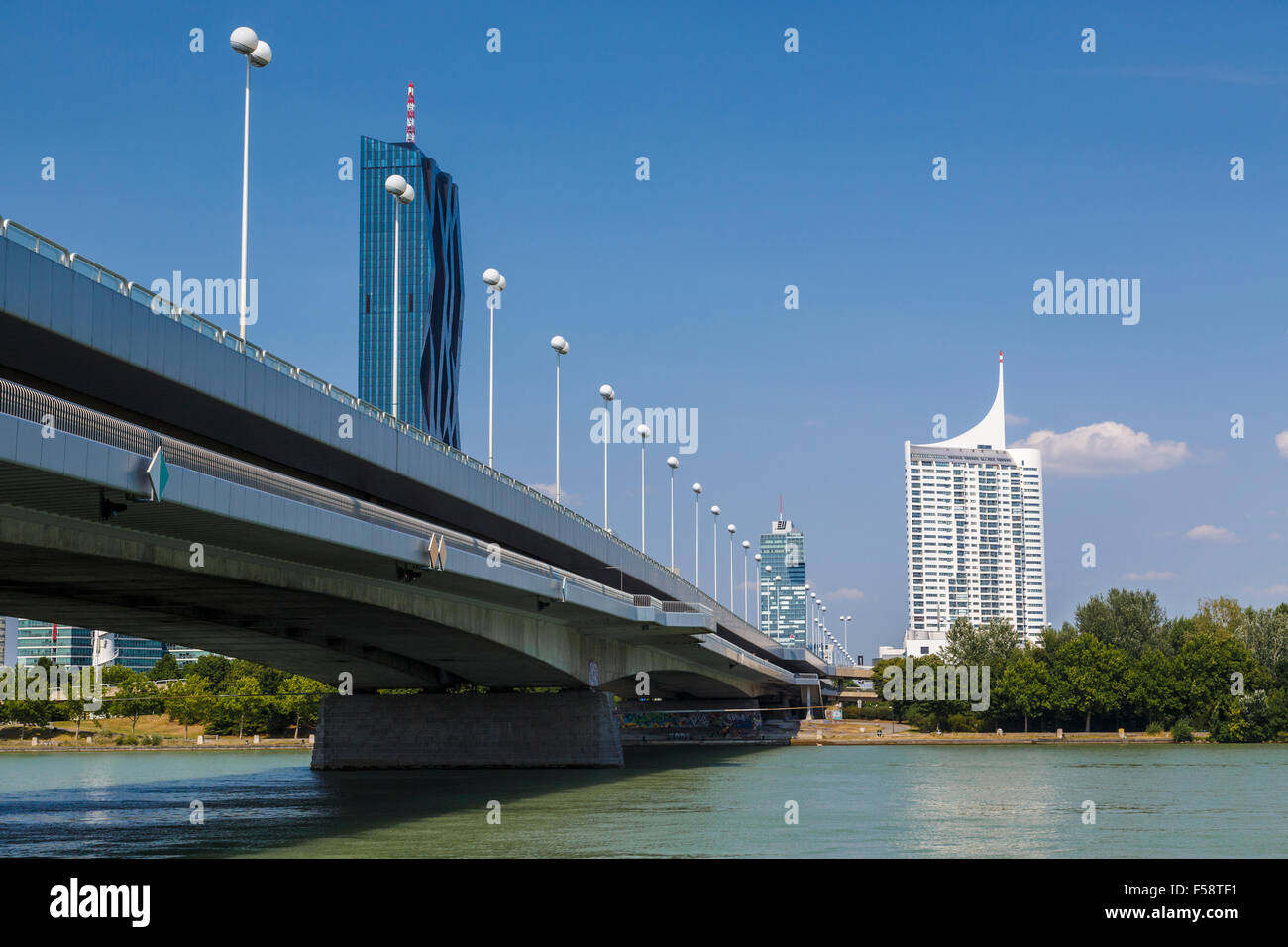 The Reichsbrücke or Empire Bridge and Neue Donau apartments. It links Mexicoplatz in Leopoldstadt with the Donauinsel, Austria. Stock Photo