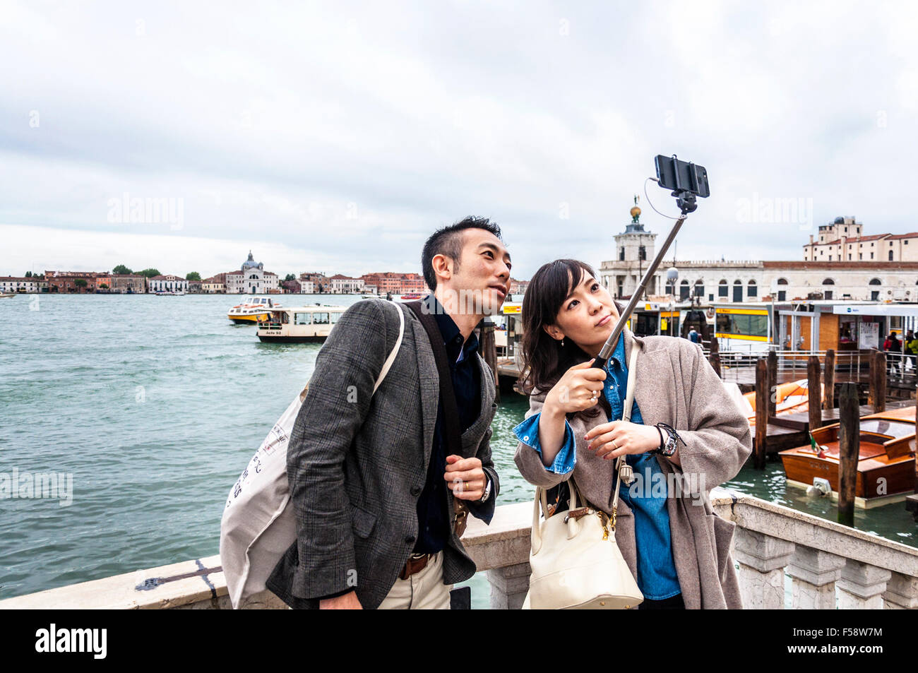 Couple take a selfie photograph in Venice, Italy. Stock Photo