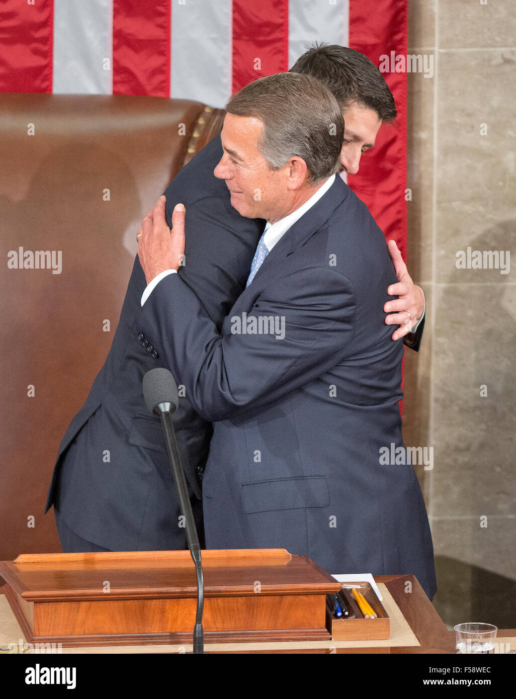 Washington, DC, USA. 29th October, 2015.  Incoming Speaker of the United States House of Representatives Paul Ryan (Republican of Wisconsin), left, is welcomed to the podium by outgoing Speaker John Boehner (Republican of Ohio), right, as Ryan assumes his duties of the office in the US House Chamber in the US Capitol in Washington, DC on Thursday, October 29, 2015. Credit:  dpa picture alliance/Alamy Live News Stock Photo