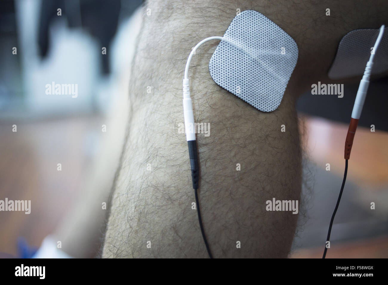 Patient knee, leg, thigh and calf in physiotherapy electrical impulse