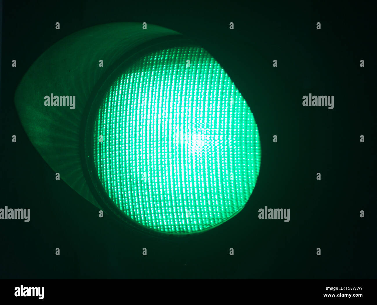 Traffic green go light photo at night on black background Stock Photo Alamy
