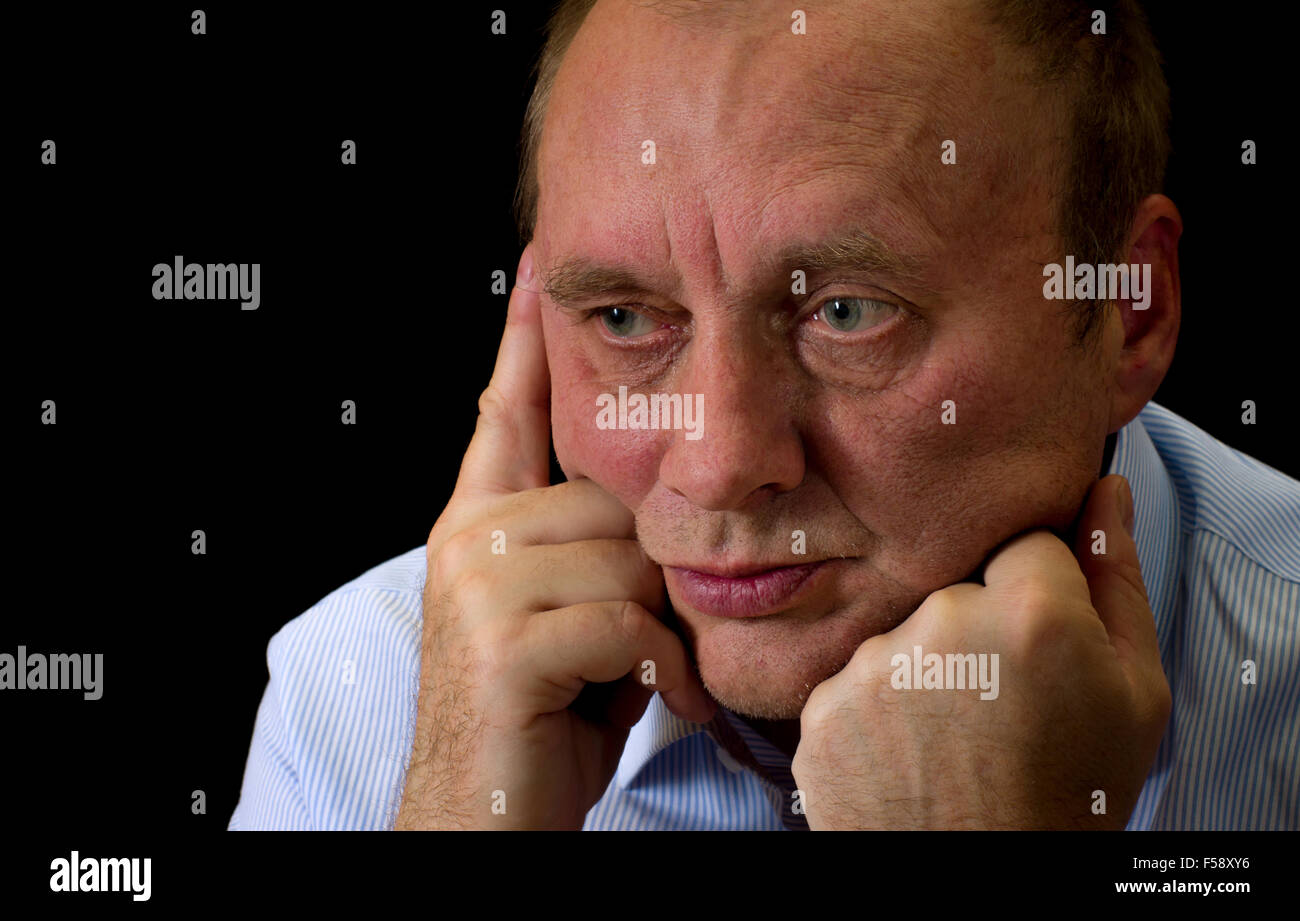 Portrait of mature man with despair on the face Stock Photo