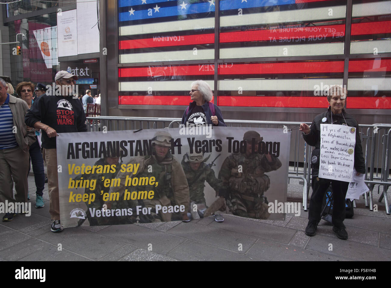 Peace activists demonstrate against keeping American Troops in Afghanistan at Military recruitment office in Times Square NYC. Stock Photo